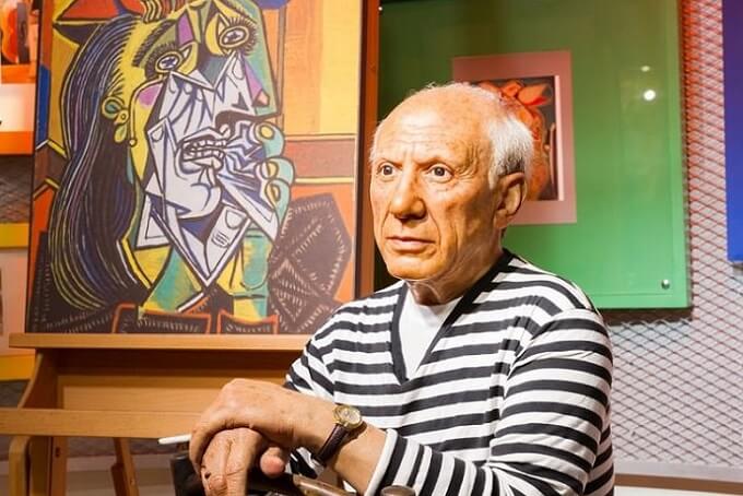 Photo of Picasso with Weeping Woman Painting